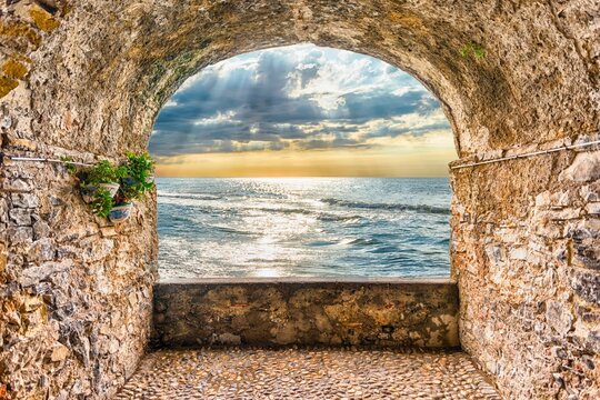 Ancient Stone Archway View of Mediterranean Sea at Sunset