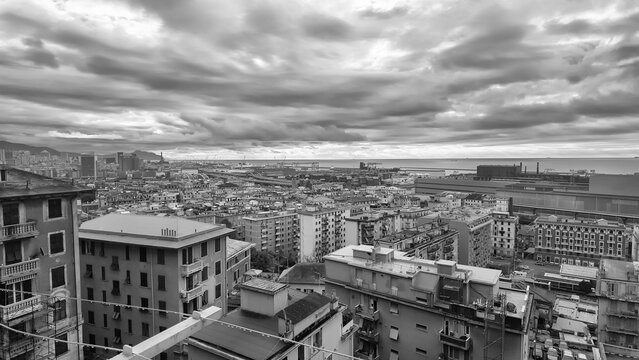 Panoramic View of Genoa Cityscape and Bustling Port, Italy