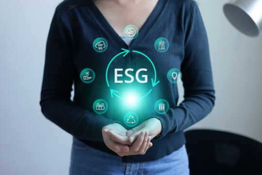 Woman Holding ESG Hologram Icon Network over Her Cupped Hands
