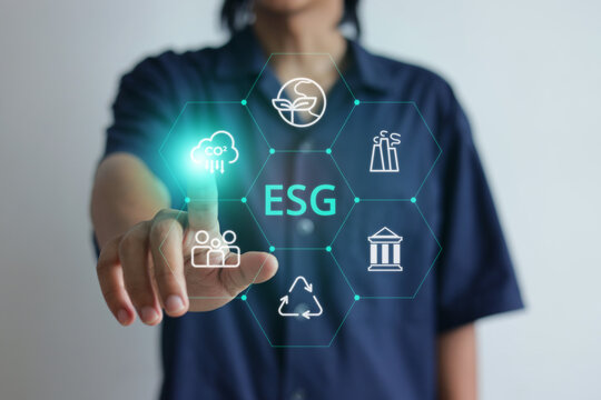 Man Pressing Carbon Reduction on ESG Hologram Screen with Index Finger