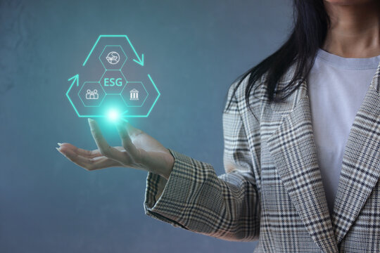 Female Holding Triangle Recycling ESG Icon Network Graphic Above Hand