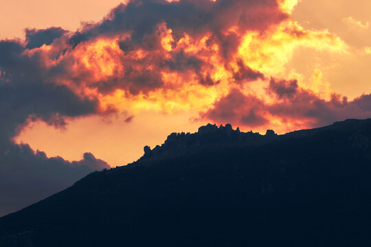 Flaming sunset clouds over the Southern Demerdji mountain summit, Crimea