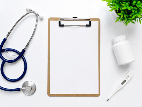 Medical Clipboard With Stethoscope and Medicine Bottle
