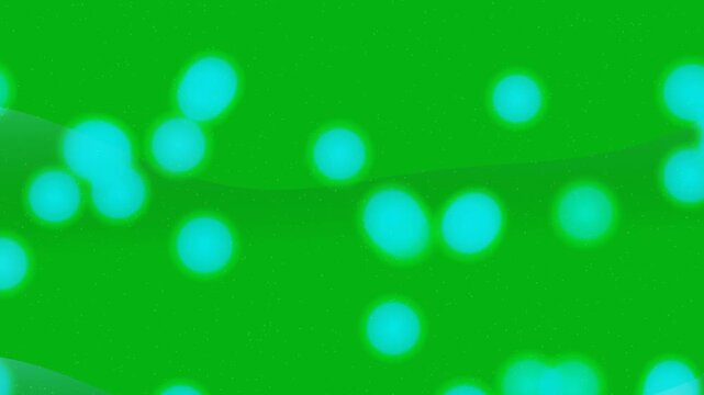 Glowing teal bokeh orbs on green background