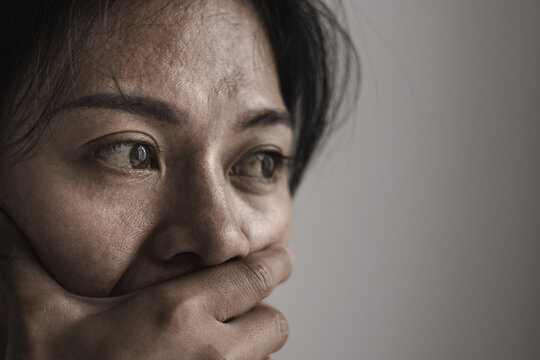 Woman crying with tears on her face, expressing deep sadness and emotional distress. Mental health awareness, depression support, women's well-being, hope, recovery, resilience, compassion, healing.