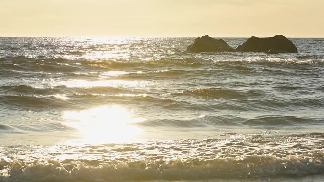 Scenic view of Baltic sea waves and rocks in strong backlight during a summer evening sunset
Finland