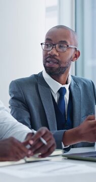 Business, team and men with laptop in meeting, talking and budget review on web or financial report. Office, discussion and black people with ideas, wealth management collaboration with technology