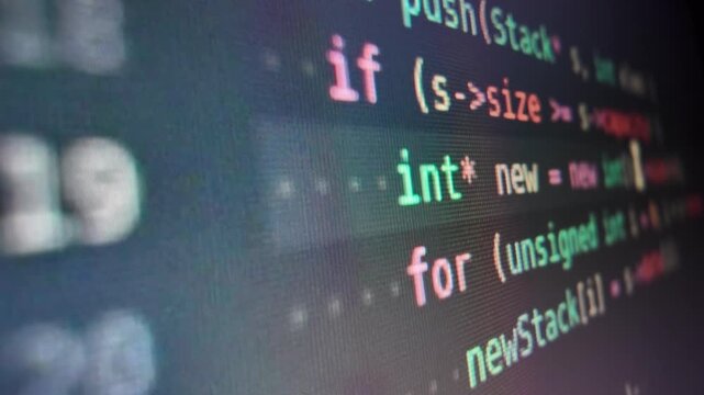 Programming code lines scrolling on computer screen close up of being displayed