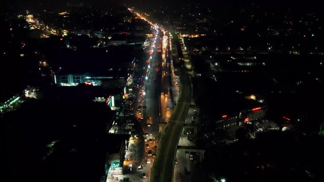 Aerial Night View of Murree Road Traffic and Illuminated Shopfronts Rawalpindi
