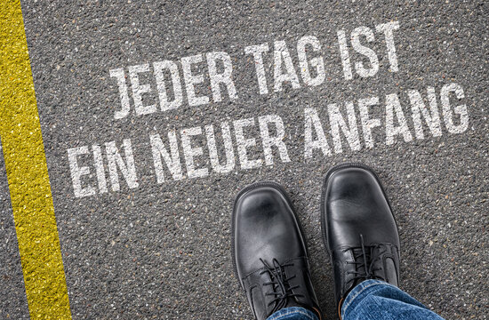  Text auf Boden - Jeder Tag ist ein neuer Anfang