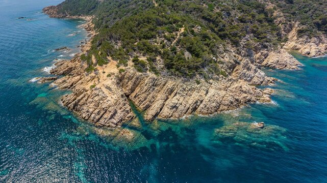 Aerial drone view of Cap Camarat rocky coastline and Mediterranean Sea, Ramatuelle, French Riviera, France