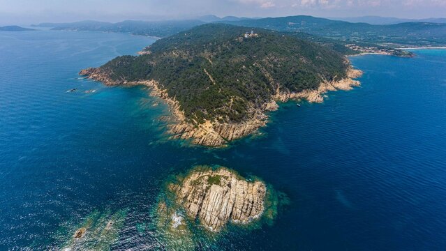 Aerial drone view of Cap Camarat rocky coastline and Mediterranean Sea, Ramatuelle, French Riviera, France