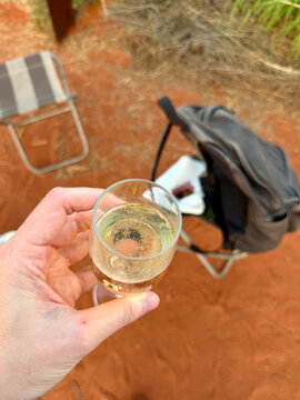 Sparkling Wine Glass Over Red Outback Desert Sand