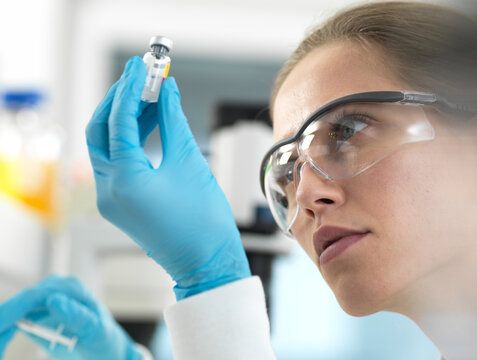Doctor preparing a vaccine for a patient