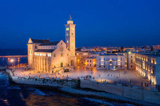 Italy, Puglia, Trani, Cathedral of San Nicola Pellegrino at night, aerial view