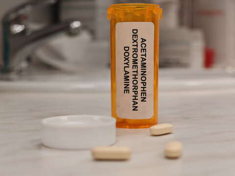 ACETAMINOPHEN DEXTROMETHORPHAN DOXYLAMINE (PARACETAMOL) analgesic and antipyretic for pain and fever on pharma laboratory research counter