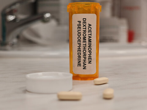 ACETAMINOPHEN DEXTROMETHORPHAN PSEUDOEPHEDRINE (PARACETAMOL) analgesic and antipyretic for pain and fever on pharma laboratory research counter