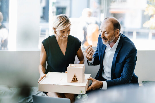 Architect explaining model to customer