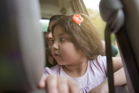 Mother and daughter traveling in a car