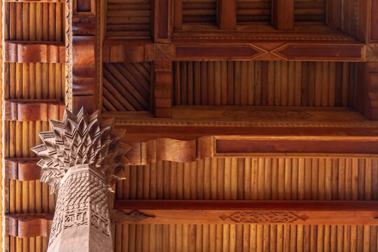 Ceiling and carved wooden column detail of iwan in Hazrati Imam Mosque, Tashkent, Uzbekistan, traditional Islamic architecture
