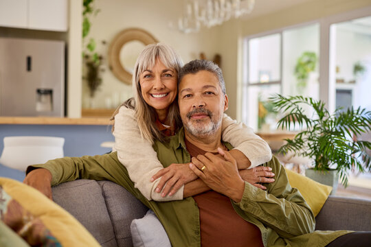 Portrait of beautiful senior woman embracing her multiethnic husband