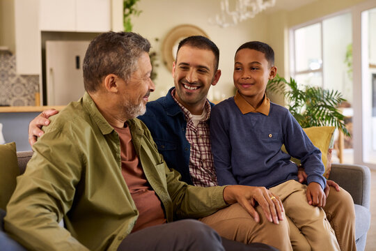 Mid adult man with his senior dad and young son laughing together