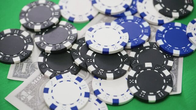 Four aces displayed above casino chips and dollar banknotes