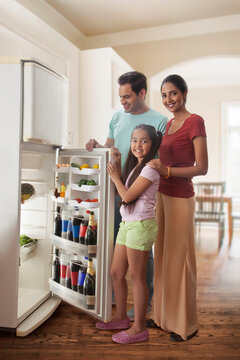 Family opening fridge