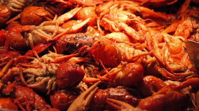 Large plate piled high with boiled crayfish served in a restaurant. Concept of seafood. . High quality 4k footage