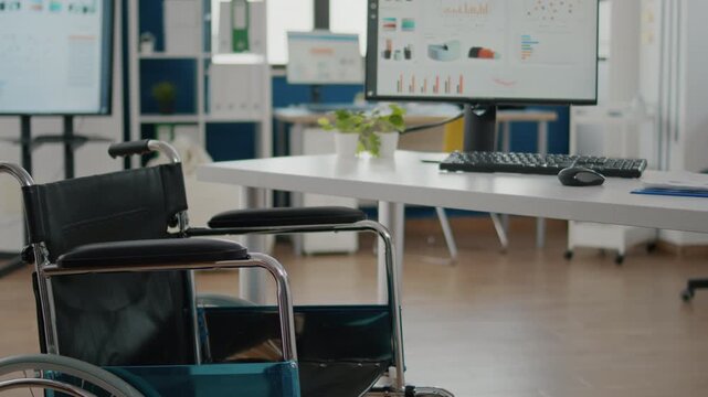 Modern office workspace featuring wheelchair accessibility and computer workstation with dual monitors