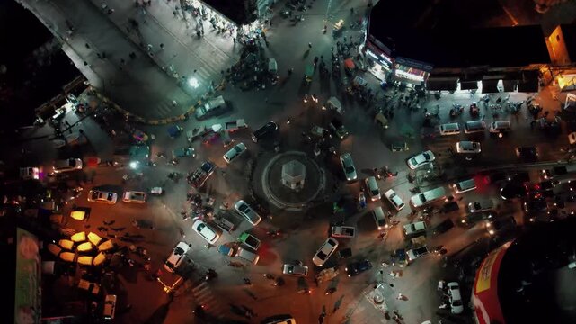 Nighttime Aerial View of Fawara Chowk in Rawalpindi Pakistan Capturing Traffic Flow, Roads and City Lights