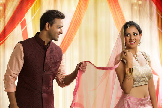 Beautiful young couple in traditional dress dancing