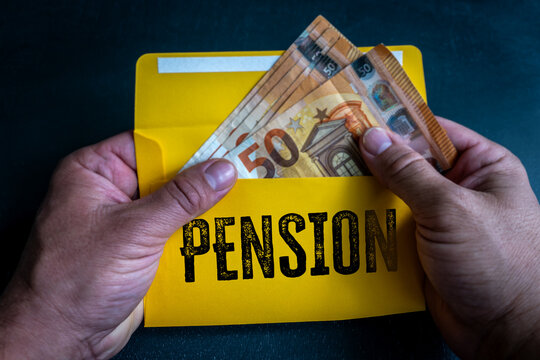 PENSION Savings in Yellow Envelope with Euro Banknotes and Hands