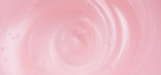 Pearlescent pink liquid soap, shower gel swirl texture, surface of liquid fluid, background, shampoo texture, body care cosmetic, texture of liquid washing gel, soap backdrop top view, from above. © Subbotina Anna