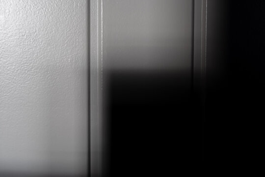 Black  White Background With Deep Shadow On Painted Wall And Door, Minimal background, Dramatic Monochrome Light, Abstract Texture And Dark Interior Scene For Mystery, Horror Halloween Design