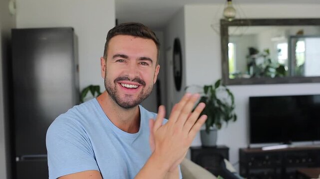 Excited man rubbing hands together in eager anticipation with bright smile
