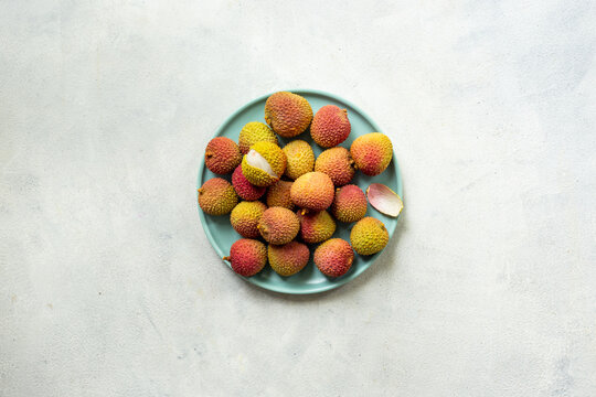 Plate of exotic lychee fruit, top view. Healthy vegetarian meal ready to eat