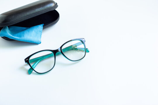 Stylish glasses for vision with case on white background. Eyesight and vision concept.