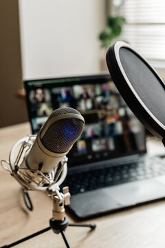 Home studio for podcast recording. Interior with microphone and laptop on table