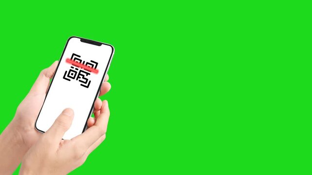 Hands holding smartphone scanning QR code on green screen background chroma key.