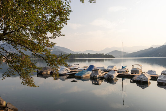 A small harbour with lake boats. A romantic landscape in Caslano, Switzerland