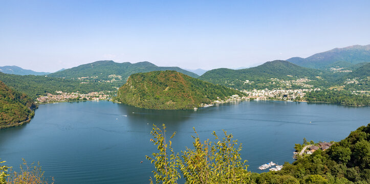 A bird&rsquo;s-eye view of the landscape overlooking Mount Caslano in Ticino. A sunny summer&rsquo;s day. The lake is a beautiful shade of blue.