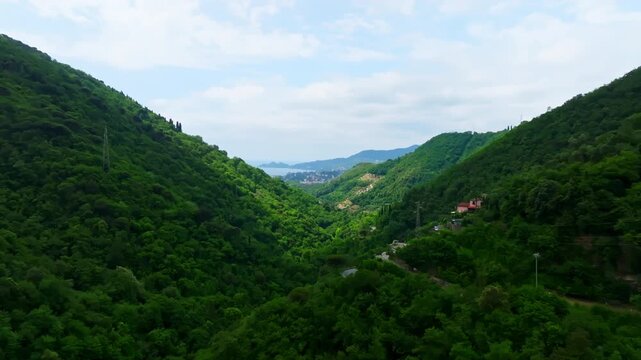 Cinematic flyover rising toward Rapallo city and the coast of Liguria, Italy
