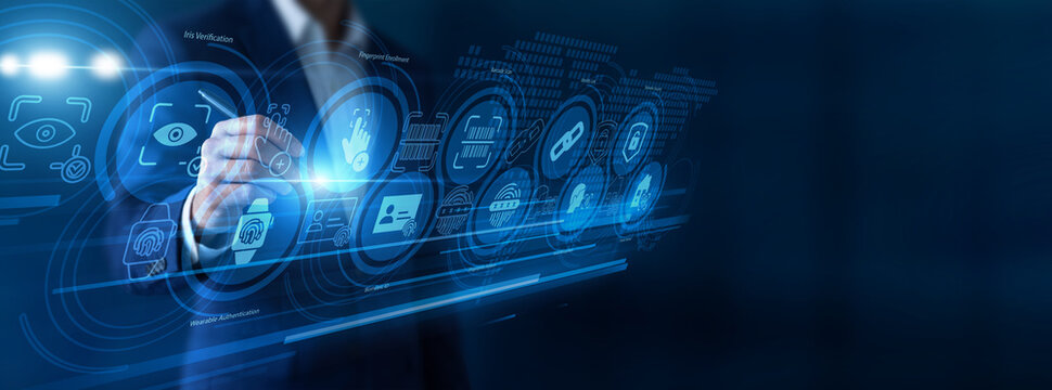 Security expert pointing the pen testing Biometric recognition on a high-tech virtual screen. Analyzing complex fingerprint and facial scans to ensure flawless authentication protocol frameworks.