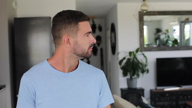Man comparing options before choosing left side and pointing smilingly.