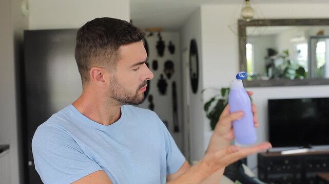 Man applying moisturizing skin cream to smooth dry hands daily