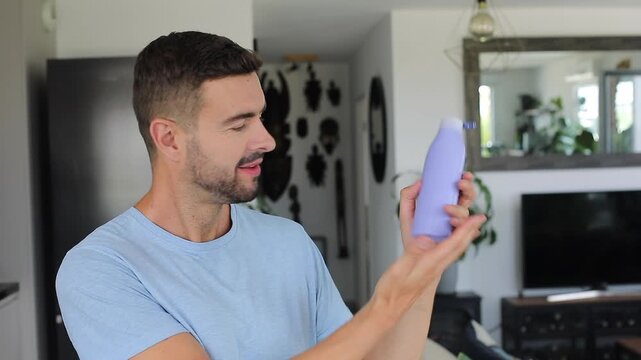 Man applying moisturizing skin cream to smooth dry hands daily