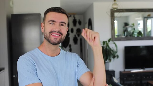 Man warming up and rotating his wrists before a workout.