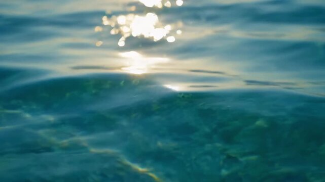 Macro ocean surface ripples with sunlight reflections