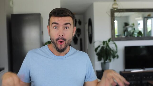 Happy man expressing absolute shock and joy after hearing amazing news